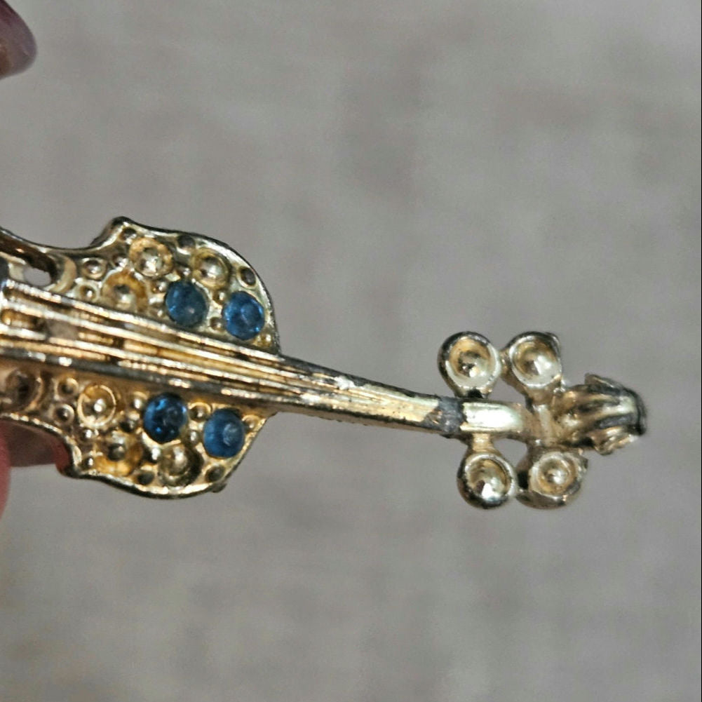 Mid-Century Gold Tone Violin Brooch with Blue Rhinestones